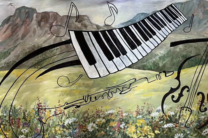 disegno di un paesaggio con la tastiera di un pianoforte